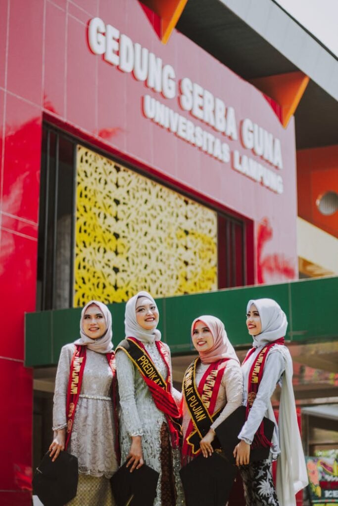 2 Women Wearing White Hijab and White and Red Long Sleeve Shirt